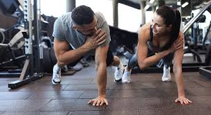 Toning Bingo Wings: Your Ultimate Guide to Sculpting Sleek Arms at the Gym 3 Fitness trainer demonstrating arm toning exercises Aldridge