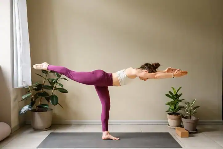 Achieving the Perfect Tone: How Often Should You Exercise for Results? 1 Woman doing Yoga exercise Aldridge to help with toning the body.